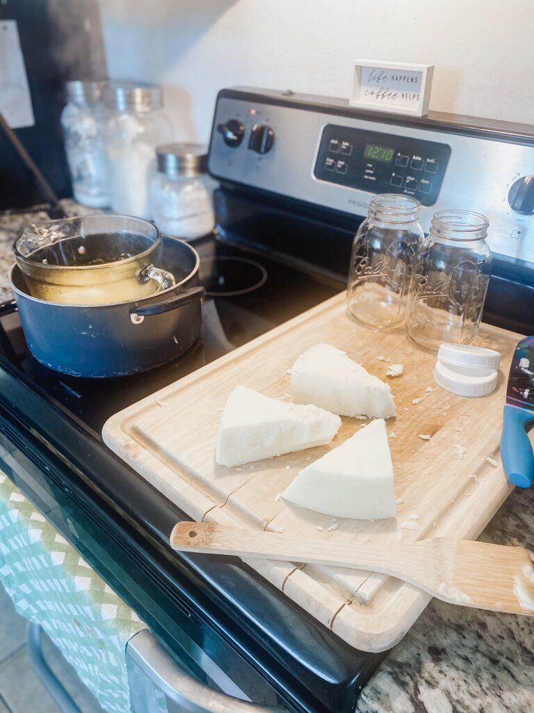 beef tallow purifying in a double boiler on stove